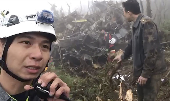 Emergency teams work at the crash site.