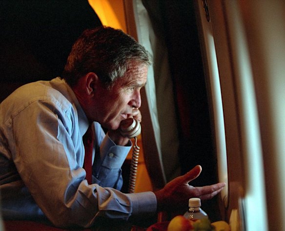 U.S. President George W. Bush speaks to Vice President Dick Cheney by phone aboard Air Force One after departing Offutt Air Force Base in Nebraska, September 11, 2001, on the day of the terror attacks in New York and Washington.
