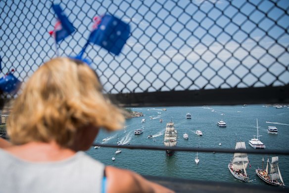 Australia Day Tall Ships race towards the Harbour Bridge in Sydney.