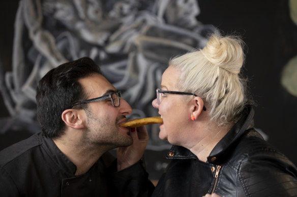 Anthony and I re-enact a scene from 'Lady and the Tramp' with a potato scallop. 