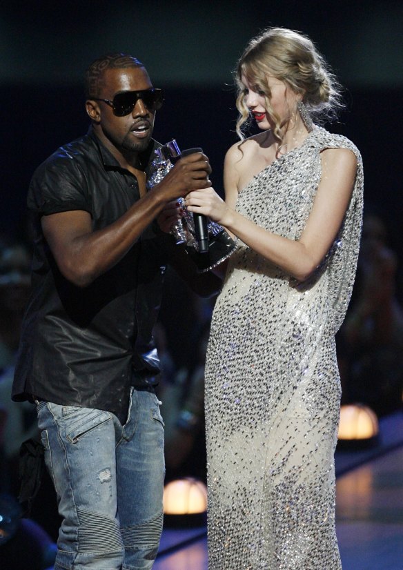 Kanye West takes the microphone from singer Taylor Swift during the MTV Video Music Awards in 2009. 