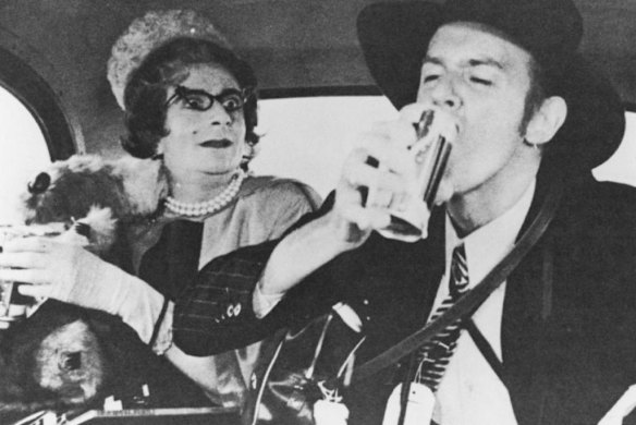 Aunt Edna (Barry Humphries) with Barry Crocker in a London taxi in a scene from The Adventures of Barry McKenzie.