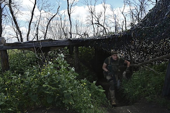 Ukrainian soldier Roman 40yrs exits a bunker at a second line position near Krasnohorivka. The soldiers in this unit have so far held off enemy advances in the area. Donetsk Oblast, Ukraine. 