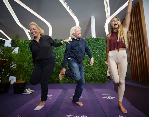 Sir Richard Branson and Sunrise's Samantha Amrytage learning yoga from Sjana Elisa Earp at the Virgin Lounge at Sydney Airport on Thursday morning, October 11, 2018.