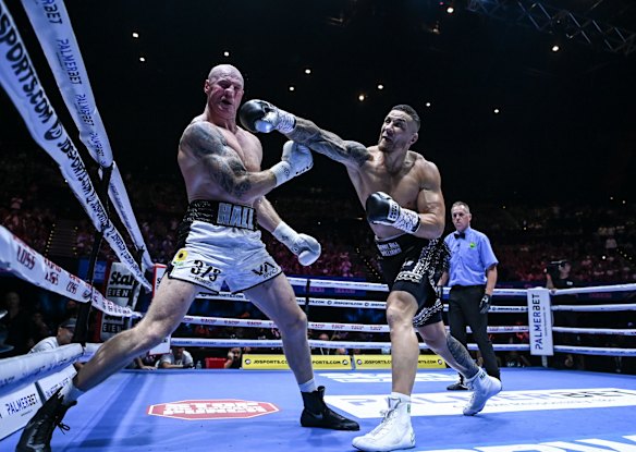 Hall feels the full force of Williams that sends the ex-Swans star to the canvas.