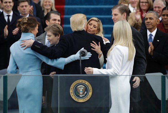 President Donald Trump hugs his family after taking the oath of office during the 58th Presidential Inauguration at the U.S. Capitol in Washington, Friday, Jan. 20, 2017. (AP Photo/Patrick Semansky)