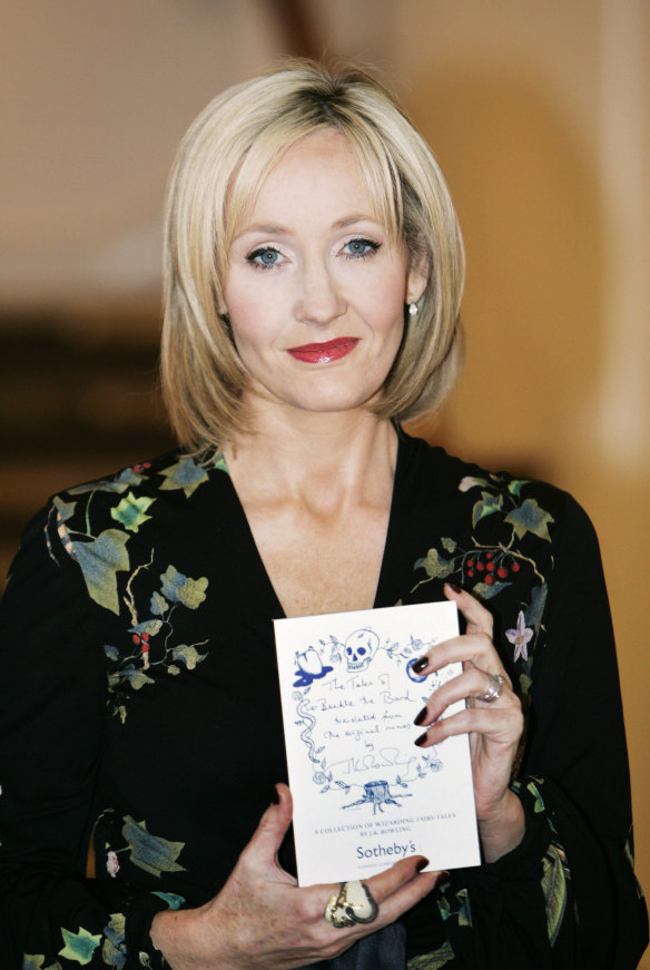 British writer J.K. Rowling, with a copy of The Tales of Beedle the Bard, now on Audible.
