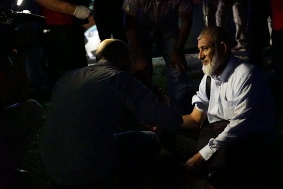 A passenger's blood pressure is checked by health officals outside Turkey's largest airport, Istanbul Ataturk, in Istanbul, Turkey.