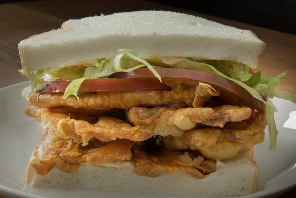 Bar Liberty's signature snack, the GLT, is a BLT sandwich with chicken-skin crackling replacing bacon.