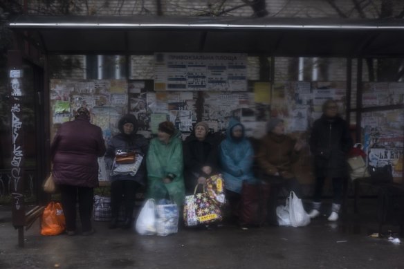 Women wait at a bus station in Kramatorsk.