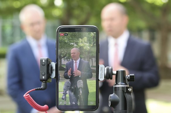 Communications Minister Paul Fletcher and Treasurer Josh Frydenberg seen on Facebook live on Tuesday during a doorstop interview about Facebook banning news.
