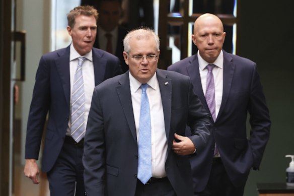 Industry, Science and Technology Minister Christian Porter, Prime Minister Scott Morrison and Defence Minister Peter Dutton enter the chamber for division on Tuesday 1 June.