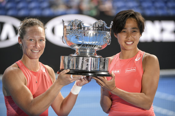 Samantha Stosur (left) and doubles partner Zhang Shuai with the silverware.