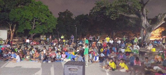 Hundreds gather around a small television in Kira Kira to watch Australia’s 1-0 win over Ireland.