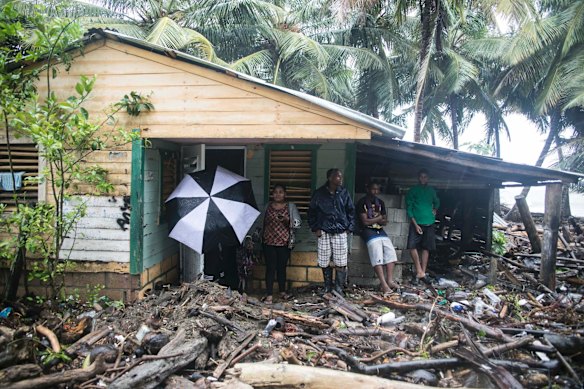 A home is surrounded by debris brought in by Irma in Nagua, Dominican Republic.