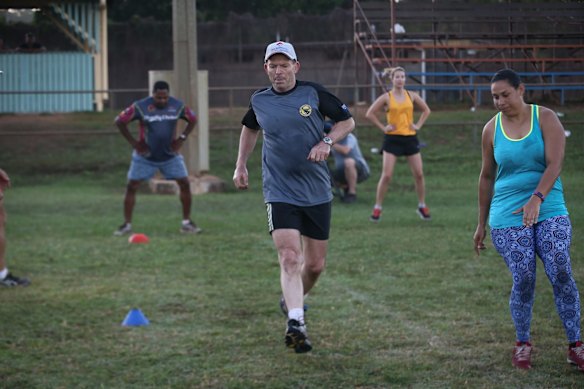 Prime Minister Tony Abbott doing physical training with members of the Bamaga community, during his visit to Cape York, on Friday 28 August 2015. 
