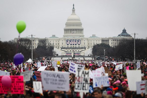 Protesters gather on the National Mall for the Women's March on Washington during the first full day of Donald Trump's presidency.
