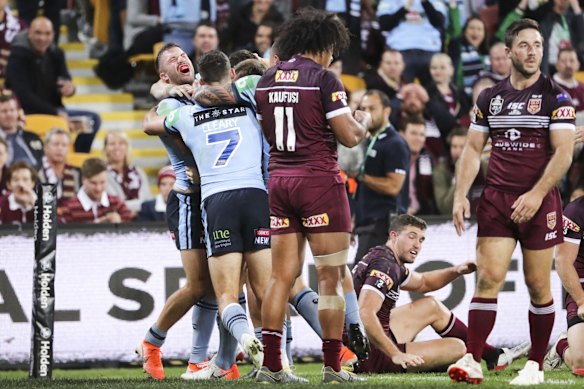 Josh Morris of the Blues scores a try.