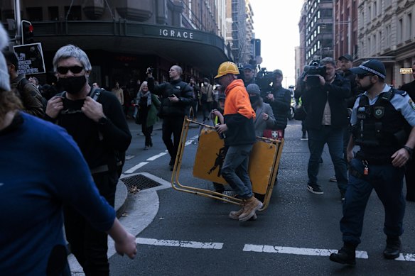 Protestors stopped traffic as they moved around the city, using bollards, chairs and construction material to block the roads.