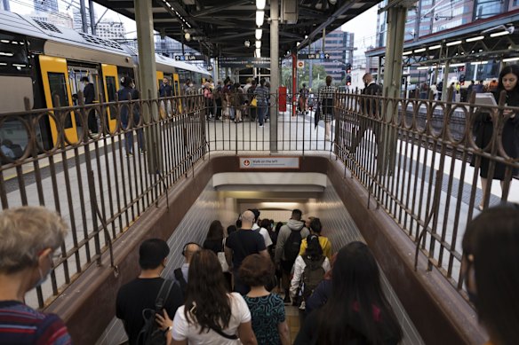 Early morning commuters at Central Station. Metro trains were back running at reduced capacity on Tuesday, with services on most lines departing every 30 minutes.