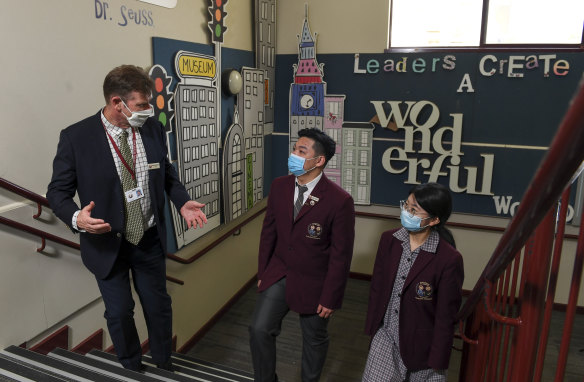 Oakleigh Grammar principal Mark Robertson with international students Sinky and Betty.