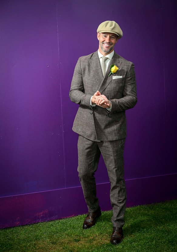 Kris Smith in a Boss suit and Serena Lindeman hat on Cup Day.