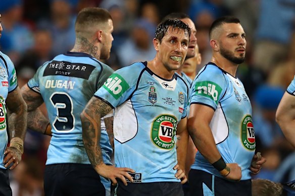 Mitchell Pearce of the Blues looks dejected after a Maroons try.
