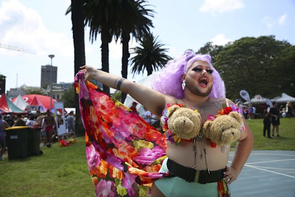 A colourful crowd enjoy the festivities and entertainment at the Gay & Lesbian Mardi Gras Fair Day at Victoria Park, Sydney.