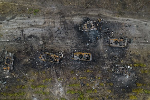 Destroyed Russian armor vehicles are seen in the outskirts of Kyiv.