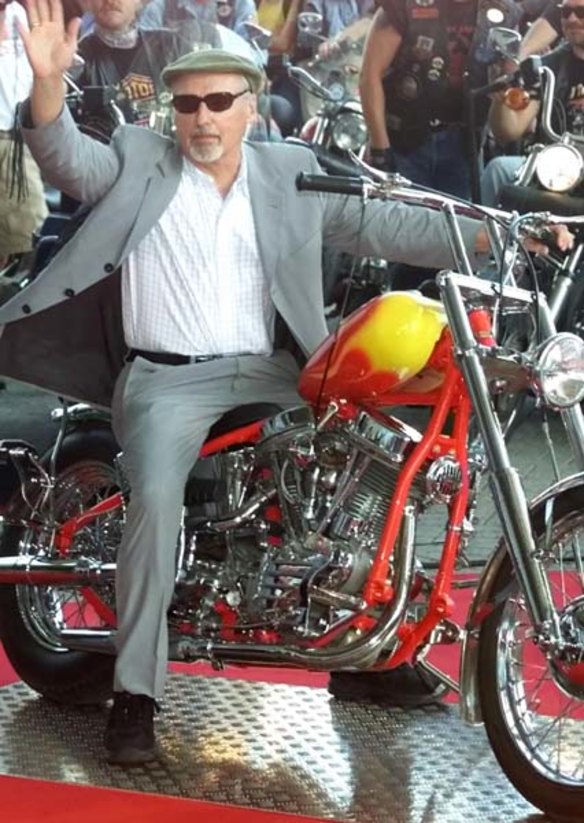 Dennis Hopper poses on a Harley Davidson motorbike at the  world exposition Expo 2000 in Hanover, Germany. 