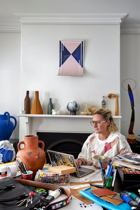 The living area, where Coffey works on her designs. The artwork is by Genevieve Felix Reynolds; the sculpture (at far right) is by Luke Storrier.