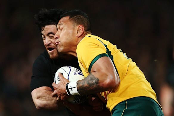 Israel Folau charges into Nehe Milner-Skudder.