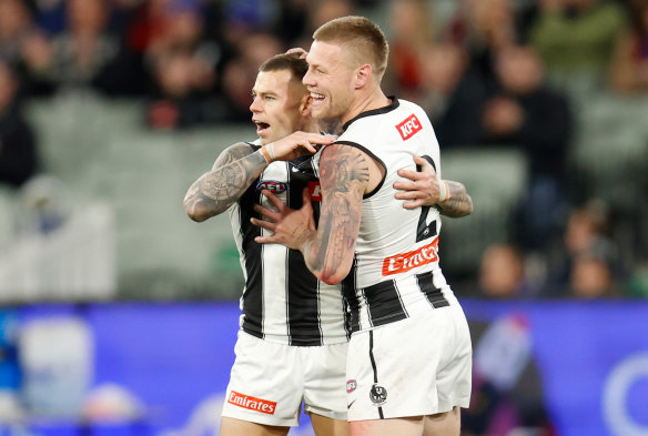 Jamie Elliott celebrates a goal with Jordan De Goey.