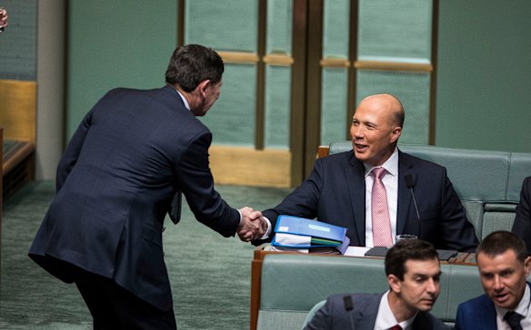Conservative agitator Kevin Andrews congratulates Dutton.