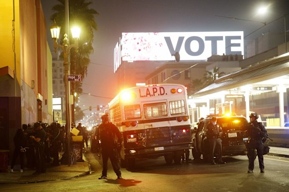 Los Angeles Police Department (LAPD) officers arrest demonstrators while protesting during the 2020 Presidential election in Los Angeles, California, U.S.