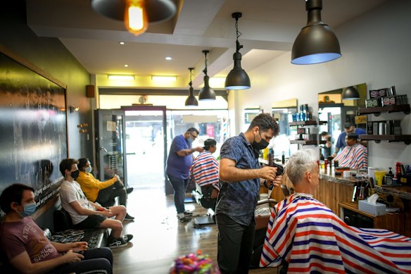 Customers  at the Peaky Blinders Barbershop in St Kilda.
