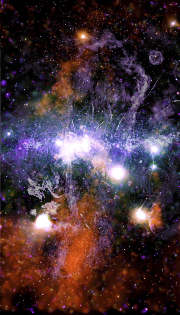 This false-colour X-ray and radio frequency image shows threads of superheated gas and magnetic fields at the centre of the Milky Way.