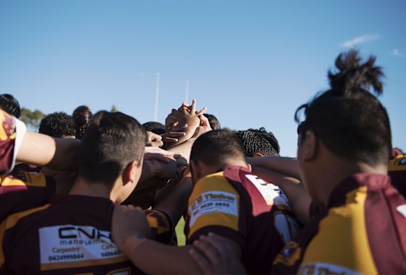 The team unites one last time before kick-off.