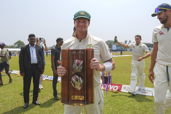 Series win: Australian captain Steve Smith poses with the Warne-Muralitharan Trophy on Sunday.