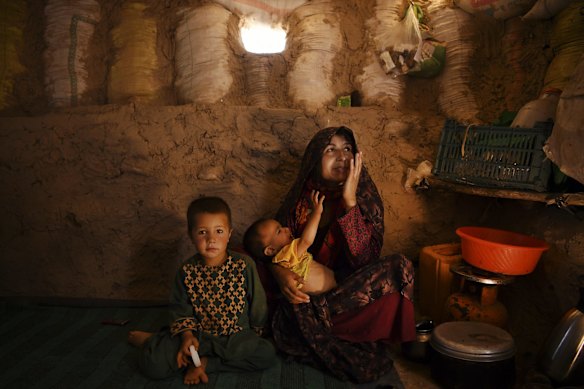 Ziba aged 21 years with her sons Suleiman (centre) aged 1 and a half years old who is suffering from severe acute malnutrition (SAM) and Ahmed aged 5 years in their temporary shelter in Regreshan IDP camp in Herat Province.