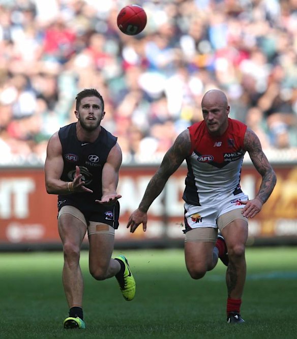 Marc Murphy marks in front of Nathan Jones.