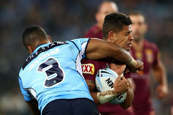 Dane Gagai of the Maroons is tackled.