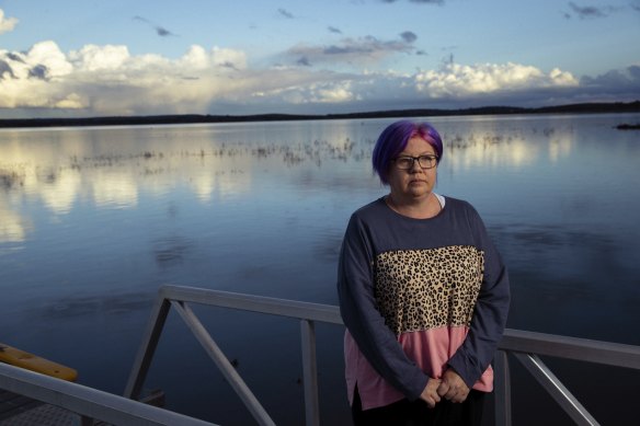 Tania Magoci, a motor neurone disease sufferer, standing by Lake Wyangan, near Griffith in the NSW Riverina.