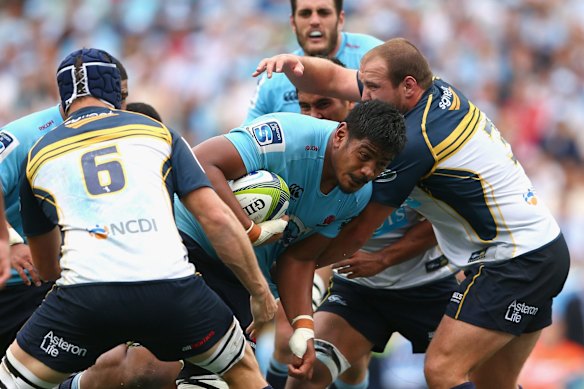 Will Skelton of the Waratahs is tackled 