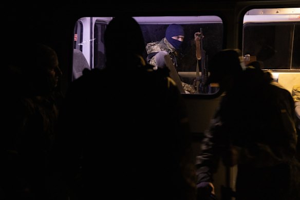 Members of the Ukrainian army search vehicles after curfew on the outskirts of Kharkiv. Although Ukraine has repelled Russian forces elsewhere in the country, it expects a renewed attack from the east as Russia tries to encircle Ukrainian troops fighting in the nearby Donbas region.