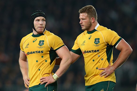 David Pocock and James Slipper look on.