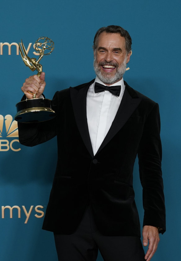 Bartlett celebrates after winning the Emmy for outstanding supporting actor in a limited anthology series or movie for The White Lotus.