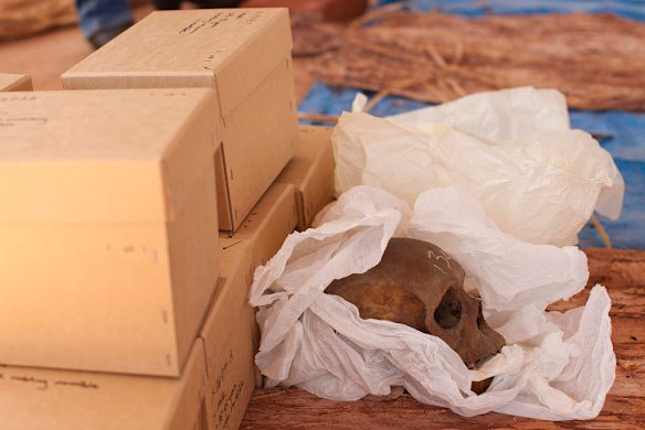 July 19th 2011, An unpacked skull awaits being covered in red ochre as human remains are finally reurned to their ancestral home in Gunbalanya for ceremonial reburial after over 60 years in the posession of the Smithsonian Institution after being collected during a combined Australian and American expedition to Arnhem Land in 1948.