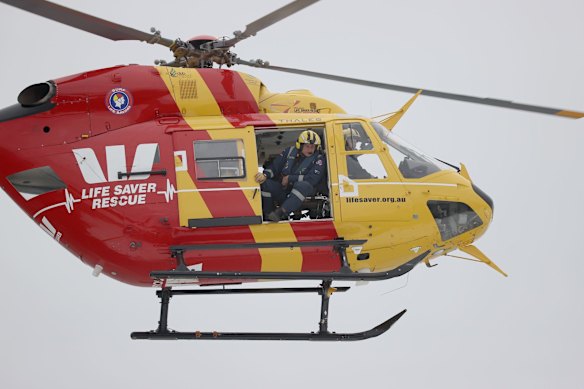 Search crews look for survivors as a small aluminium boat sinks offshore in the big swell at Bondi Beach. Police later confirmed the owner was safe and well, and had last seen his boat moored at Gordons Bay.