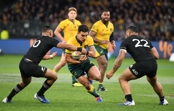Evasive: Matt Toomua during the clash with New Zealand. 
